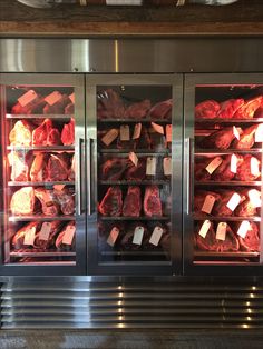 the meat display case is full of different types of meat