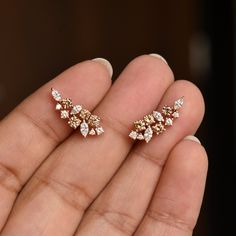 "An exclusive piece from our shop, these earrings are absolutely to die for..! Special Earrings for your special day. A bunch of beautiful natural white, light brown and dark brown diamonds, hand picked and arranged in a grand symphony! Your heart will surely skip a beat.. Ours did.. :) * Gemstone : Natural White & Champagne Diamonds (Untreated) * Total Diamond Wt. : 0.86 Ct * Clarity Grade : Vs-Si * Gold - 14k, 2.5gm ROSE gold (approx.) If you like this earring, please press \"Pin it\" butt Champagne Diamond Earrings, Special Earrings, Gold Ear Climbers, Brown Diamonds, Diamond Ear Cuff, Diamond Cluster Earrings, Ear Crawlers, Ear Climbers, Brown Diamond