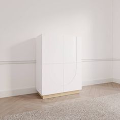 a white cabinet sitting in the middle of a room next to a carpeted floor