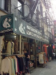 an old fashion clothing store on the street