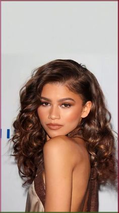 an image of a woman with curly hair and brown eyeshadow on the red carpet