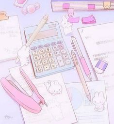 an image of some stationery items on top of a desk with pens and pencils