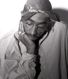 a man wearing glasses and a bandana on his head