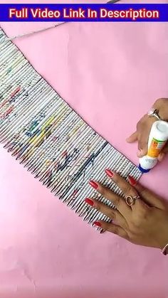 a woman is using glue to paint nails on a piece of pink paper with the words, full video link in description