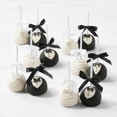 wedding cake pops with black and white decorations