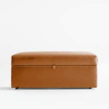 a large brown leather box sitting on top of a white floor