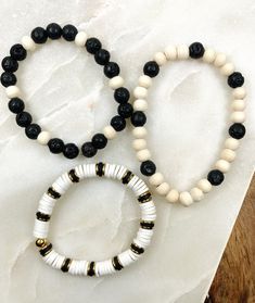 Beach Black Heishi Beads Bracelet, Black Letter Beads Bracelet For Beach, Black Bracelets With Letter Beads For Beach, Casual Beach Stretch Bracelet With Wooden Beads, Casual Wooden Beads Stretch Bracelet For Beach, Casual White Stretch Bracelet With Wooden Beads, Beaded Bracelets For Boys, Bracelet Ideas For Boys, Boy Bracelets