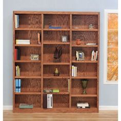 a wooden bookcase with many books on it