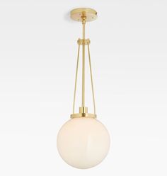 a white ball hanging from a brass colored ceiling light with two lights on each side