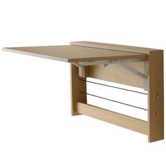 a wooden shelf with two metal bars on it