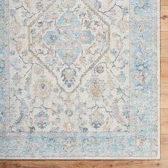 an area rug with blue and beige colors