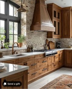 a kitchen filled with lots of wooden cabinets and counter top space next to a window