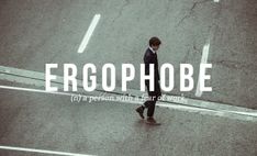 a man walking across a street with the words ergophobe on it