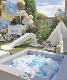 an outdoor party with balloons and teddy bears