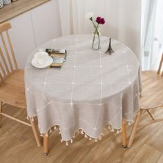 the table is set with two chairs and a book