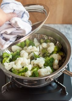 broccoli and cauliflower cooking school day 16 steam is on the stove