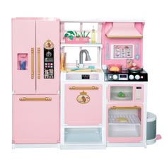 a toy kitchen with pink appliances and accessories