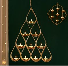 a gold chandelier with candles hanging from it