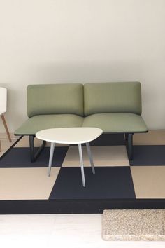 a living room with two couches and a coffee table on the floor in front of it