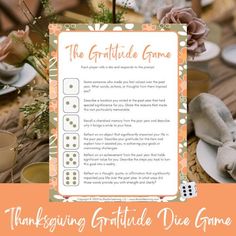 the thanksgiving gratitude dice game is displayed on a table with flowers and other things around it