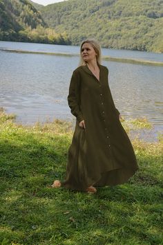 "Introducing our Military Linen Shirt Dress - a versatile and stylish addition to your wardrobe.  This Maxi Linen Dress features a wide and asymmetrical silhouette with long sleeves that end  with a cuff and a button. The collared neckline adds a touch of sophistication to this relaxed linen  dress. Wear it as outerwear with a slip dress underneath, or add a belt to shape the waist and  create a more fitted look. Crafted from high-quality, organic linen fabric, this dress is both durable and breathable, making  it the perfect choice for warm weather. Our Military Linen Dress comes in a range of sizes,  including plus size, to ensure the perfect fit for every body type. Looking for a stylish and comfortable Summer Maxi Dress? Look no further than our collection  of relaxed linen dresses! Ou Linen Abaya, Linen Dress Summer, Linen Dress Women, Linen Shirt Dress, Dress Linen, Maxi Robes, Linen Maxi Dress, Summer Maxi, Organic Linens