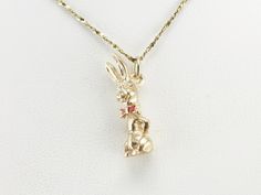 Ahhh what's up doc? This vintage rabbit charm is quite sweet with his bright red bow tie and moving head, we think this would make for a great good luck charm, a twist on the lucky rabbit's foot! This pendant does not come with the chain shown. Please feel free to contact us, we will help you find the perfect chain for your style and budget! Metal: 14K Yellow Gold Material: Red Enamel Measurements: 21 x 7 mm Marks: "14K" Stamped What's Up Doc, Rabbits Foot, Rabbit Charm, Lucky Rabbit, Red Bow Tie, Vintage Rabbit, Cameo Ring, Luck Charm, Luck Charms