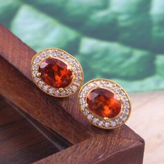 This Sterling Silver Jewelry set features an Elegant Art With Natural Hessonite Gemstone. The cavity is made from genuine solid 925/92.5 Sterling silver with 18k Gold Plating and stamped as S925. This Jewelry is Lead free and Rhodium plated to prevent scratches and tarnish. ITEM DESCRIPTION Item Code: JACBS2/45 Metal: 18k Gold over 925/92.5 Sterling Silver Gemstone: Genuine Natural Hessonite Gemstone Shape: Oval Gemstone Size: 6 X 8 MM Ring Dimension:- Length: 12 MM Width: 11 MM Weight: 3.93 gm Elegant Oval Amber Gemstones, Luxury Round Amber Jewelry, Round Gold Gemstones Fine Jewelry, Exquisite Yellow Gold Gemstones For Gifts, Elegant Citrine Round Stone Jewelry, Exquisite Yellow Gold Round Gemstones, Elegant Round Citrine Stone Jewelry, Exquisite Gold Gemstones With Accents, Yellow Gold Jewelry With Cubic Zirconia And Gemstone Accents