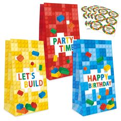 three party bags with legos on them and the words, let's build