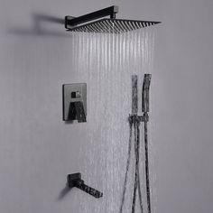 an overhead shower head with rain and water running from it