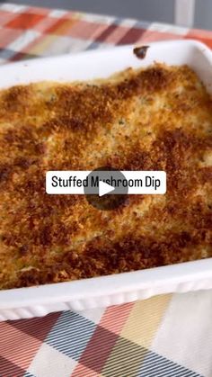 a casserole dish on a table with the words stuffed mushroom dip in it