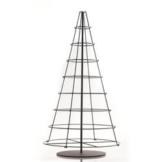 a metal wire christmas tree on a white background