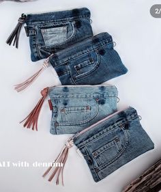 three pairs of jeans with tassels on them