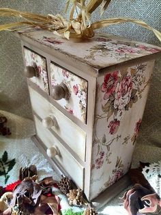 an old dresser with flowers painted on it