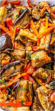 the dish is prepared and ready to be cooked in the oven, with carrots, peppers