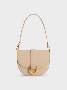 A perennial favourite for good reason, this beige iteration of our Gabine saddle bag channels sleek sophistication in spades. Made with genuine leather for a luxurious look and feel, this neutral-toned beauty features resplendent gold-toned Gabine buckle and hardware for a chic and polished finish. Endlessly versatile, let this bag be your new favourite style companion for office days, date nights, and everything in between. Team this with a crisp white blouse, earth-toned pants and your sky-hig Purse Aesthetic, White Shoulder Bags, Crisp White Blouse, Lady Dior Handbag, Tan Bag, Leather Saddle Bags