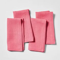 pink linen napkins folded on top of each other