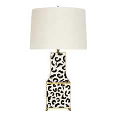 an animal print lamp with a white shade