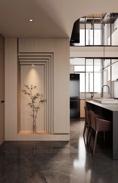 an open kitchen and dining area with marble flooring