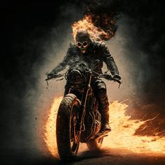 a man riding on the back of a motorcycle in flames