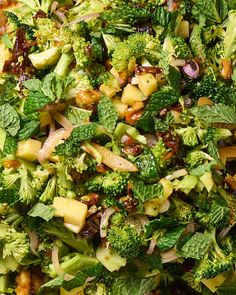 a mixture of broccoli and other vegetables is mixed together to make a salad