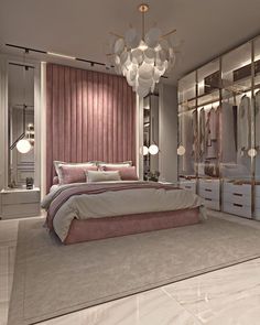 a bedroom with a large bed, mirrored walls and chandelier hanging from the ceiling