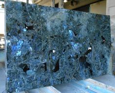 a large piece of blue marble with holes in it