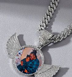 "Add your favorite person and keep the memories going with this custom sublimation picture pendant necklace. Product description: CZ Angel Wings/Heart/Medallion Memory Pendant Hip Hop Jewelry *Cubin Link chain is 18 Inches Zinc Alloy Gold plated, Rose gold plated, Silver plated over Copper Gemstone: Cubic zirconia  This listing is for Circle Angel Wings as pictured. Each pendant comes with matching 18-22\" necklace chain.  PLEASE send HIGH QUALITY photos as described. Picture will be sized down Cheap Customized Necklace As Gift, Cheap Personalized White Jewelry, Luxury Custom Necklace As Gift, Cheap Custom Silver Necklace, Luxury Pendant Custom Necklace As Gift, Luxury White Gold Custom Necklace, Luxury Necklaces For Commemoration, Cheap Custom Pendant Necklace For Personalized Gift, Luxury Personalized Pendant Necklace