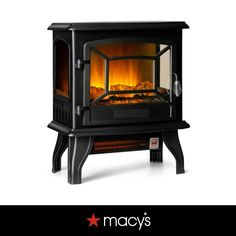 an electric stove with the words macy's on it and a fire burning inside