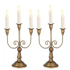 a set of four candles sitting next to each other