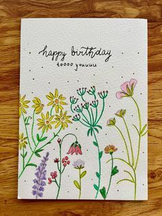 a card with flowers on it that says happy birthday