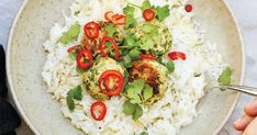 a white plate topped with rice and vegetables