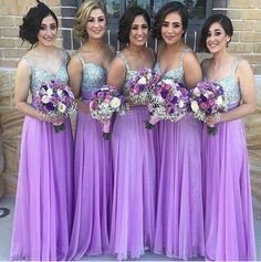 the bridesmaids are all wearing purple dresses