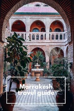 an archway leading into a building with potted plants in it and the words marrinkesh travergulia