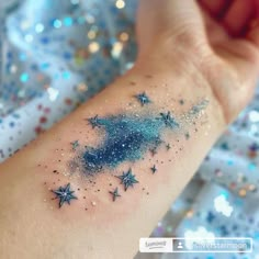 a woman's arm with stars on it